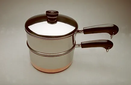 Figure 1-1: You need a double boiler or some type of impro-visation to melt your wax. A small pot, mounted on a trivet inside a larger pot, works just fine.