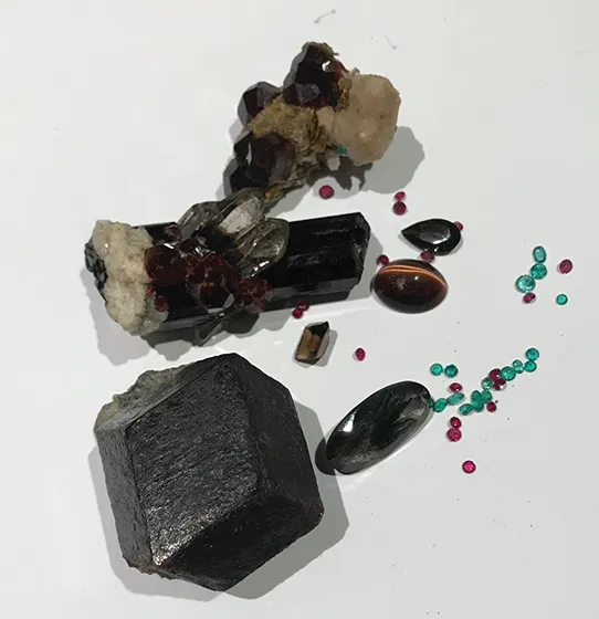 Image of gemstones containing aluminum compounds: Topaz, ruby, tourmaline, emerald, turquoise, lapis, garnet, and even forms of jade.
