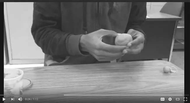 Figure 12.3 and 12.4 Student creating pinch pot independently during a follow up probe without the use of a video model or prompting.