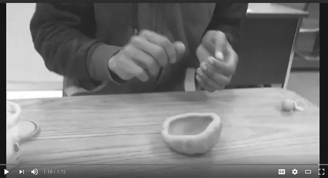 Figure 12.3 and 12.4 Student creating pinch pot independently during a follow up probe without the use of a video model or prompting.