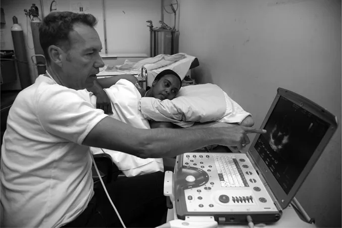 Photo 1.1 Testing the aerobic fitness (a) and cardiac function and structure (b) before and after 16 and 64 weeks of recreational football training for sedentary 20- to 45-year-old women.
