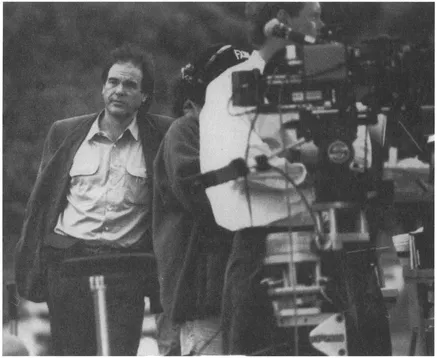 Oliver Stone on the set of JFK, a film he produced, directed, and cowrote. Copyright Ā© 1991 Warner Bros. Inc., Regency Enterprises V.O.F. and Le Studio Canai + .