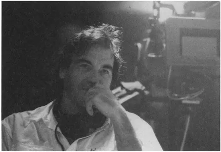 A seemingly fatigued yet contemplative Oliver Stone on the set of his 1991 film The Doors. Copyright Ā© 1991 Tri-Star Pictures, Inc.
