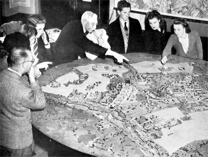 Figure 1.1 Residents study the plan for a new town, c.1951
