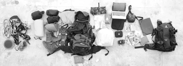 Figure 1.4 A tourist packing on the roof of the hostel in Kathmandu, Nepal. Often ample room is required to spread out items during packing