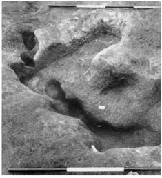 FIG. 3 Tattershall Thorpe: Feature 19 after excavation, from the north-east. The circle and post-holes are Neolithic, with the rectangular early medieval grave cutting it. Burrowing animals had caused considerable disturbance From a colour slide by N. Hawley