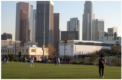 Figure 1.1. Soccer player in Vista Hermosa Park with the backdrop of downtown’s skyscapers, 2011
