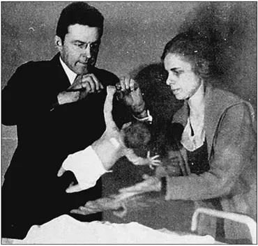 Plate 1.2 J. B. Watson and assistant (and wife-to-be) Rosalie Rayner studying grasping in a baby.