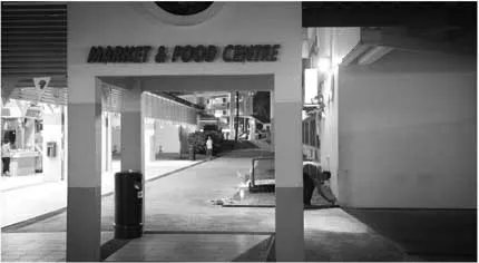 Figure 1.1 Hawker planting makeshift altar in Singapore.
