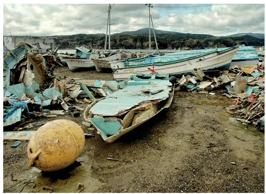 Above: Tsunami-impacted coastal conditions near Shizugawa, Japan, showing storm-damaged boats and other jetsam. A group of fishermen who lost everything asked AfH for help in 2011.