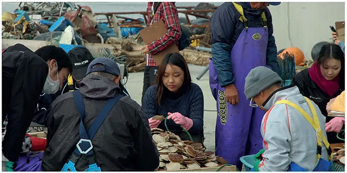 Fishermen in Shizugawa and students from Kyoto University of Art and Design working together as part of the AfH workshop in 2011.