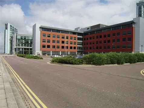 Figure 1.4 Suburban-style developments located on Liverpool’s historic Pier Head, complete with standard parking requirements, road splays, and buffer planting