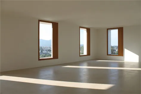 Figure 1.5 The windows seen from the interior of 2226 display the depth of the super-insulated wall section. Polished concrete floors provide thermal mass.