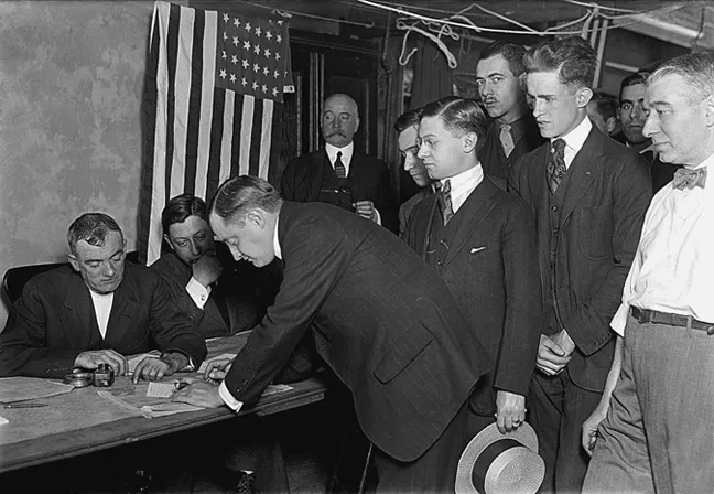 Figure 1.2 United States citizens signing up for military service