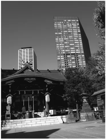 FIGURE 1.1 A Shinto shrine in the heart of Tokyo. With soaring prices for land this shrine is surrounded by a lush temple forest that offers not only spiritual amenities but also relaxation to its visitors. Source: Bas Verschuuren.