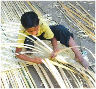 RANGE OF STAKEHOLDERS: Even children contribute to the reconstruction task in Bangladesh.