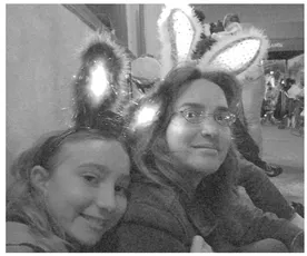 Figure 1.2. Laurie and Alex attending a 2009 Mardi Gras parade in New Orleans. Photograph by Paul Farnsworth.