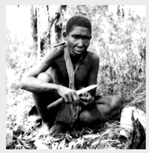 Figure 1.1. Hadza great-grandmother Wande pauses in the course of a tuber collecting trip in the Eyasi Basin, northern Tanzania during the early dry season, 1986. Older women may have played an important role in human evolution by providing tubers that enabled young children to be weaned at an early age. Photo by James O'Connell