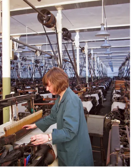 Queen Street Mill, Burnley, England. This once-typical weaving shed from 1894, its looms powered by a Lancashire steam mill engine through line-shafting and belt-wheels, is now unique and preserved as a working cotton mill. The accident of survival has made this a site of outstanding importance. (Neil Cossons)