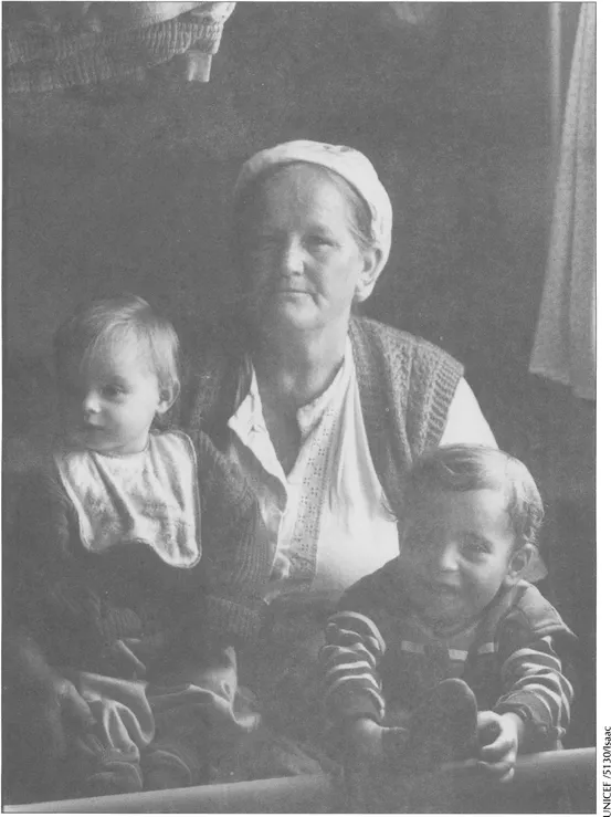 A woman and her two grandchildren living in a makeshift refugee camp in the town of Resnick, near Zagreb (Croatia). Families in the region have suffered not only from armed conflict but also from the deterioration of social safety nets and social services brought about by the transition.