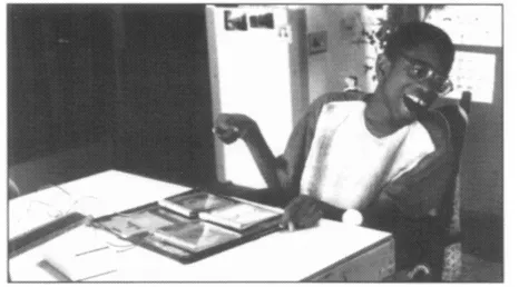 Fig. 1.2 Pupils can use a simple communication machine to initiate interaction through a range of switches.