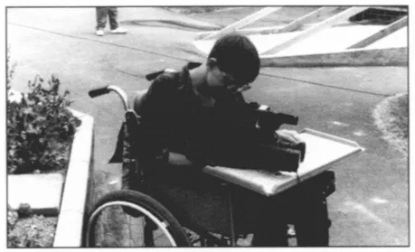 Fig. 1.4 Paul is using a video camera to record aspects of school life to discuss later.