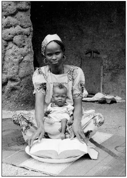 Posing with Koran and baby