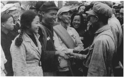 Chinese communists viewed women's liberation as a necessary and inevitable part of socialist revolution. Partisans and members of the People's Liberation Army greet each other in 1949.