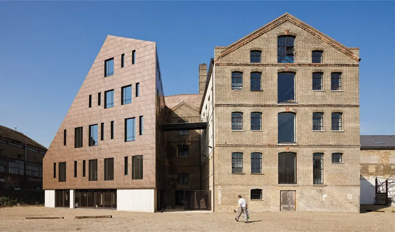 Figure 1.01 The 19th‑century Granary, Barking, with a bronze‑clad extension completed in 2011