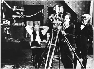Figure 1.2 Charlie Chaplin at his hand-cranked Bell and Howell model 2709 camera.