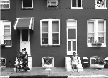 Figure 1.1.Every summer, the Afro- American newspaper organizes a Clean Block Competition in Baltimore and awards prizes for the best- looking street blocks. The improvements in the blocks reflect residents’ coordinated efforts. This photo was taken in the Upton neighborhood in 1978.