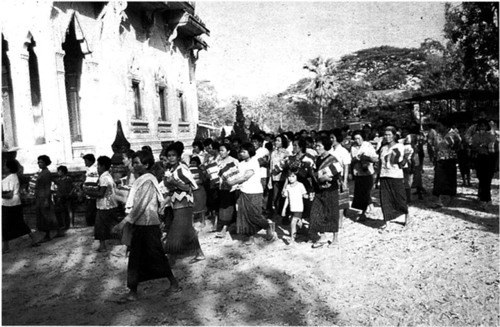 Plate 1.2: Villagers in the procession circling temple grounds.
