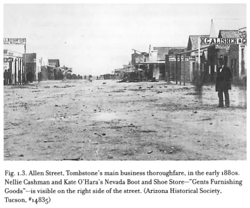 Image: Fig. 1.3. Allen Street, Tombstone’s main business thoroughfare, in the early 1880s. Nellie Cashman and Kate O’Hara’s Nevada Boot and Shoe Store—“Gents Furnishing Goods”—is visible on the right side of the street. (Arizona Historical Society, Tucson, #14835)