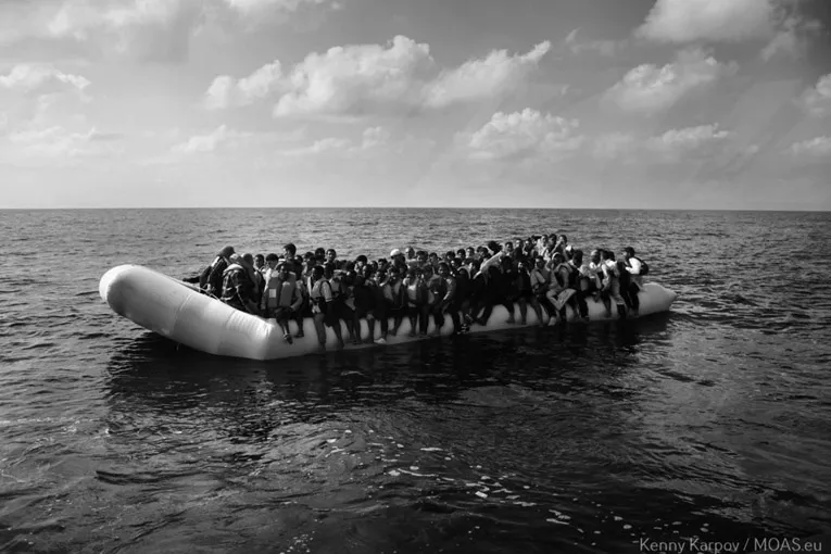 Figure 1.3 Kenny Karpov, refugees in the Mediterranean Sea after setting off from Libya to Malta on a flimsy inflatable raft before being rescued, 2016.