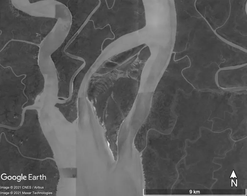 Satellite image of islands in the middle of a river; compared to image of the same location as image in figure 1.1. Later image indicates rapid formation of larger land mass around smaller sandbars depicted in 1985 image.