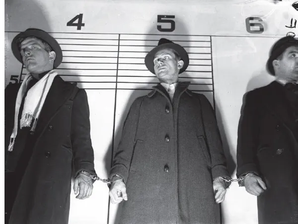Paroled convict Joseph Schuster, center, was identified by robbery victims as the killer of policeman Arthur Sullivan...