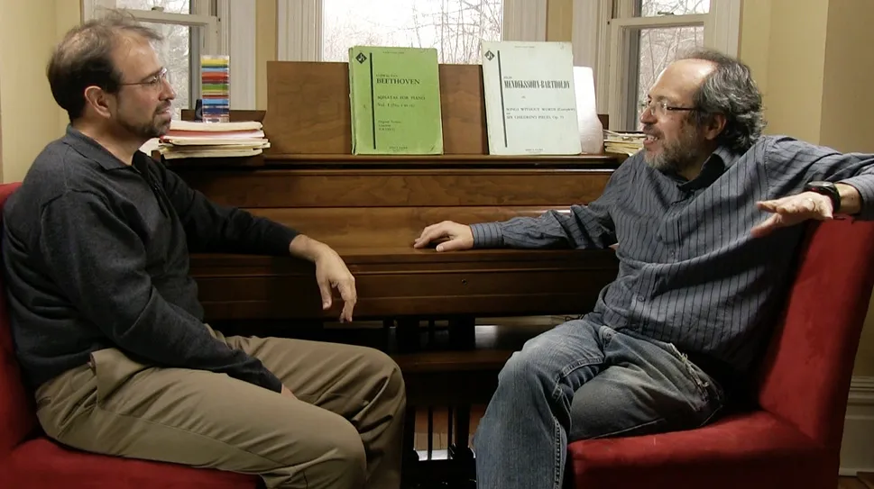 Photo of Stefan Collini and Howard Burton in conversation