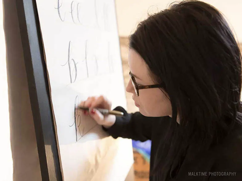 Molly Suber Thorpe teaches a calligraphy workshop.