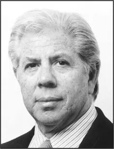 A professional portrait of Carl Bernstein wearing a suit and tie.