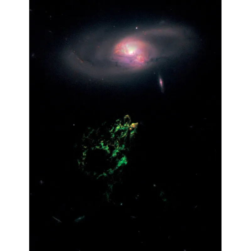 Una curiosità spaziale! L’unica parte visibile di Hanny’s Voorwep, una nube di gas lunga 300 anni luce che si estende intorno a una galassia spirale. © NASA, ESA, W. Keel (University of Alabama) and the Galaxy Zoo Team.