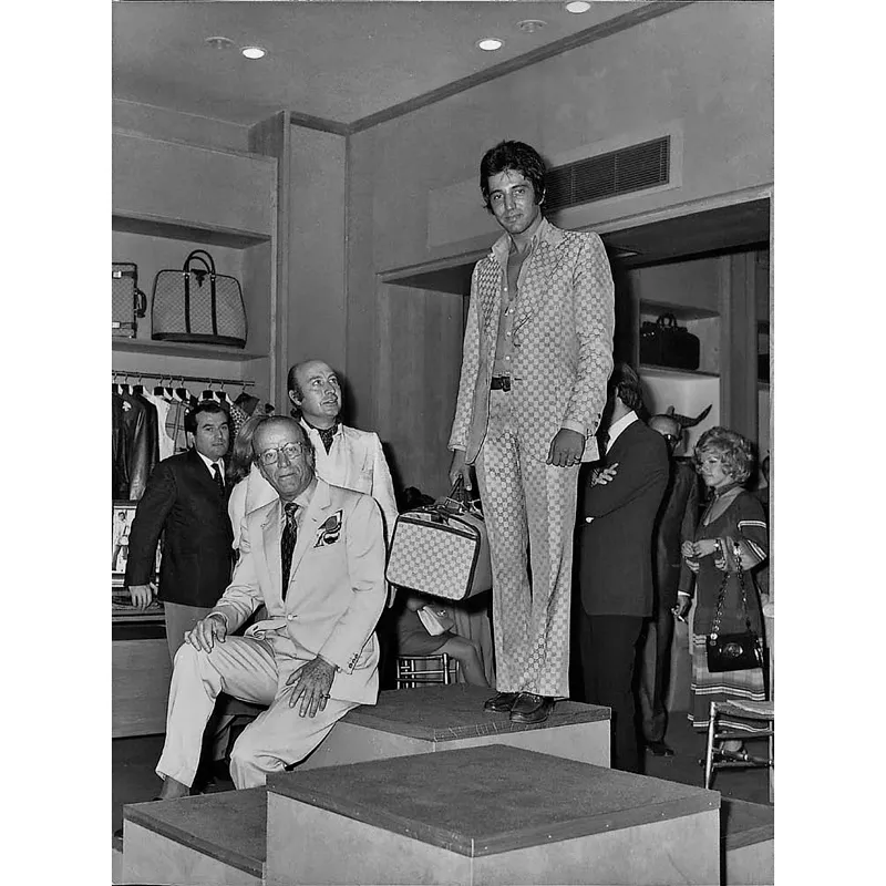 Mio padre Paolo e mio nonno Aldo alla prima sfilata nel negozio di via Condotti, a Roma, negli anni Settanta.