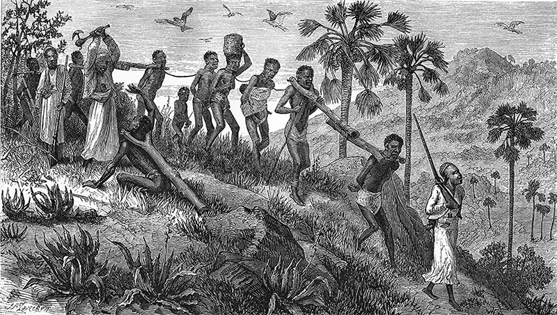 Una carovana di schiavi diretta a Kilwa, 1865 circa. Gli uomini sono assicurati a rami biforcuti detti «slave sticks», mentre le donne sono legate insieme da corde strette al collo.