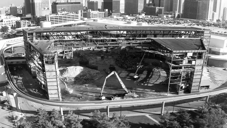 Cranes rising over the construction site of the new NHL Hockey and NBA Basketball arena in downtown Detroit.