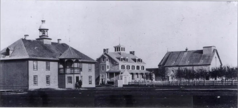 Photograph of three beautiful stand along houses with a big garden. All three houses have been constructed in different ways. There is a wooden fence separating the houses and gardens from each other. Green bushes can be seen on the right side of the fence. A group of people are standing in front of the first house. Below these houses is a photo of a senior person who looks like a dignity.