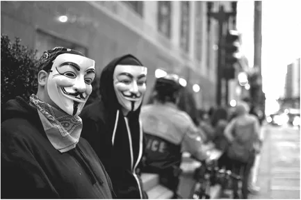 Figure 1.2 Chicago, IL. Occupy Chicago protestors wearing Guy Fawkes masks (10/14/2011). Credit: Michael Kappel