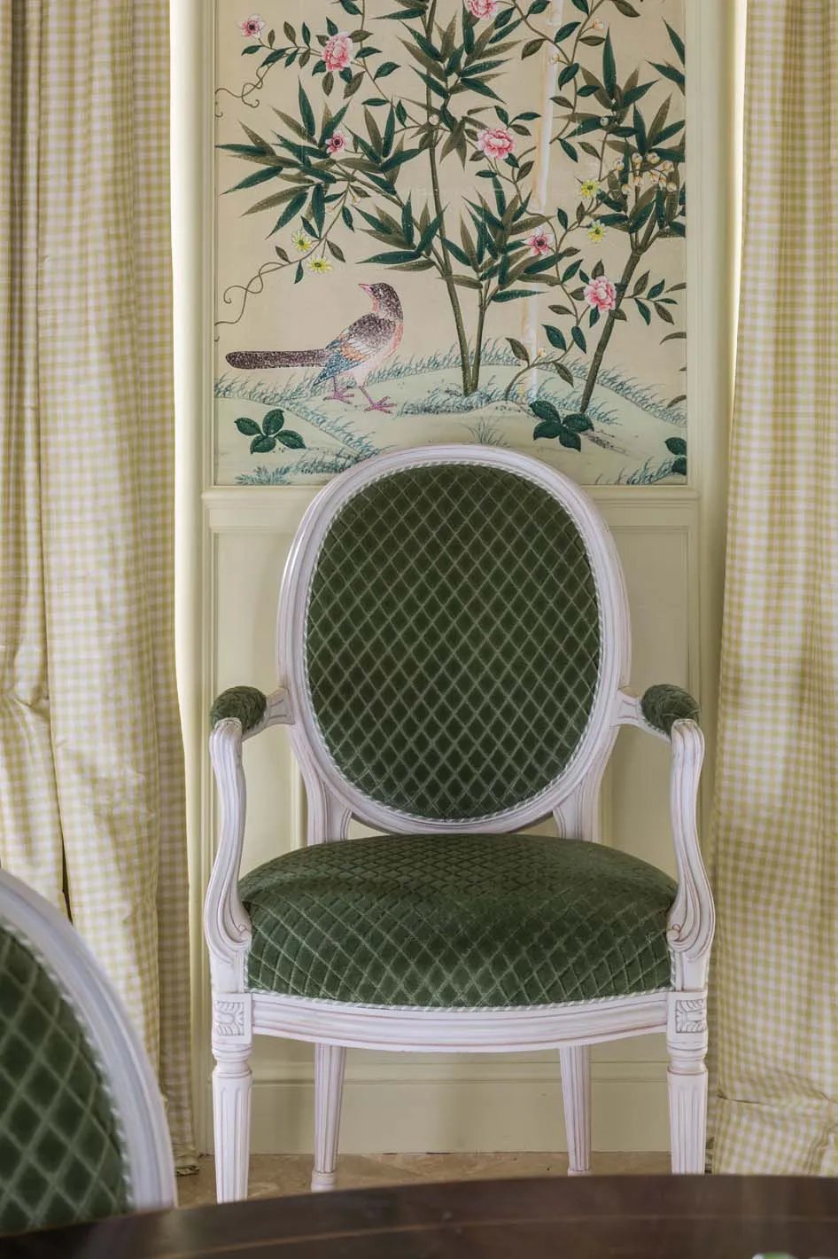 These silk panels are an elegant accent for the Chinese wallpaper in this dining room. The soft green-and-cream gingham pattern tones down the luxury of the silk, creating a sophisticated country charm. Notice the tiny half-inch ruching along the leading edges.