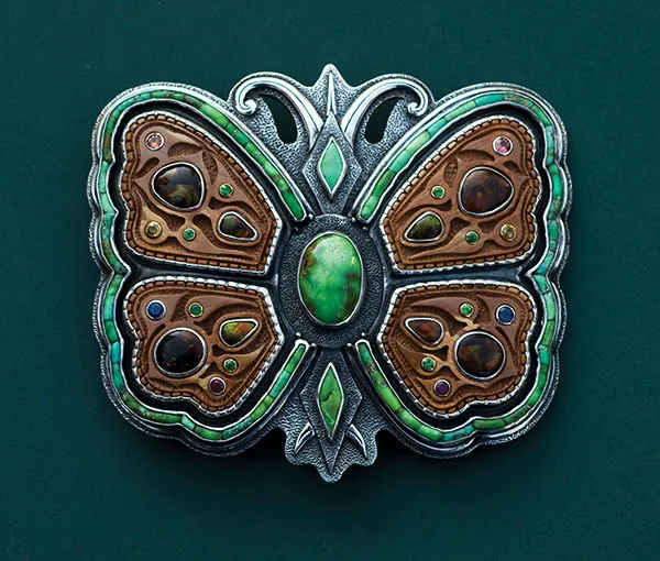 Photo of butterfly buckle with inlays.