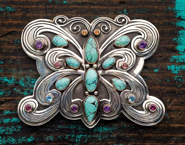 Photo of butterfly buckle with turquoise.