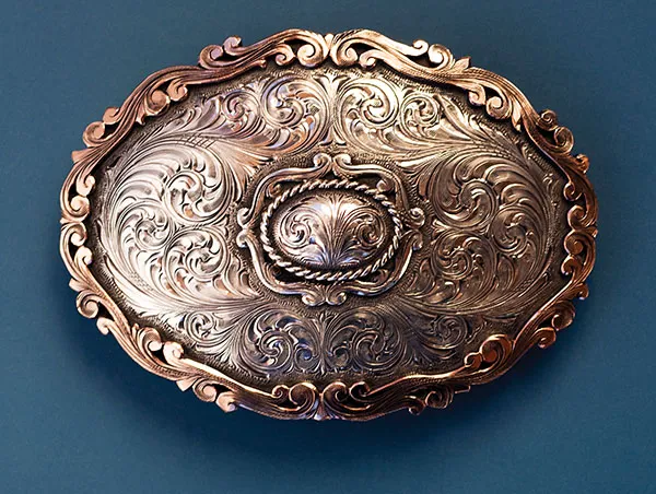 Photo of buckle with scrollwork.