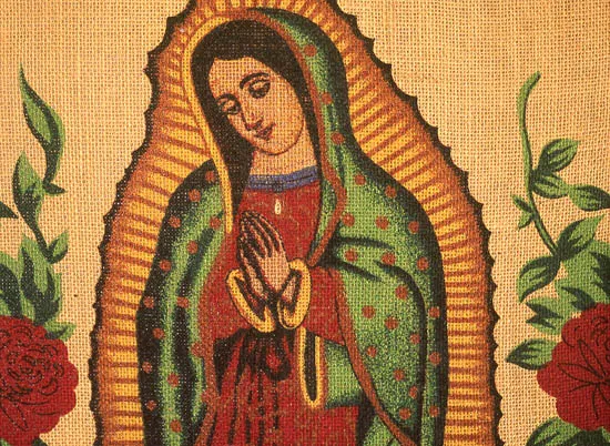 Photo of Virgin of Guadalupe, stenciled on a burlap handbag.